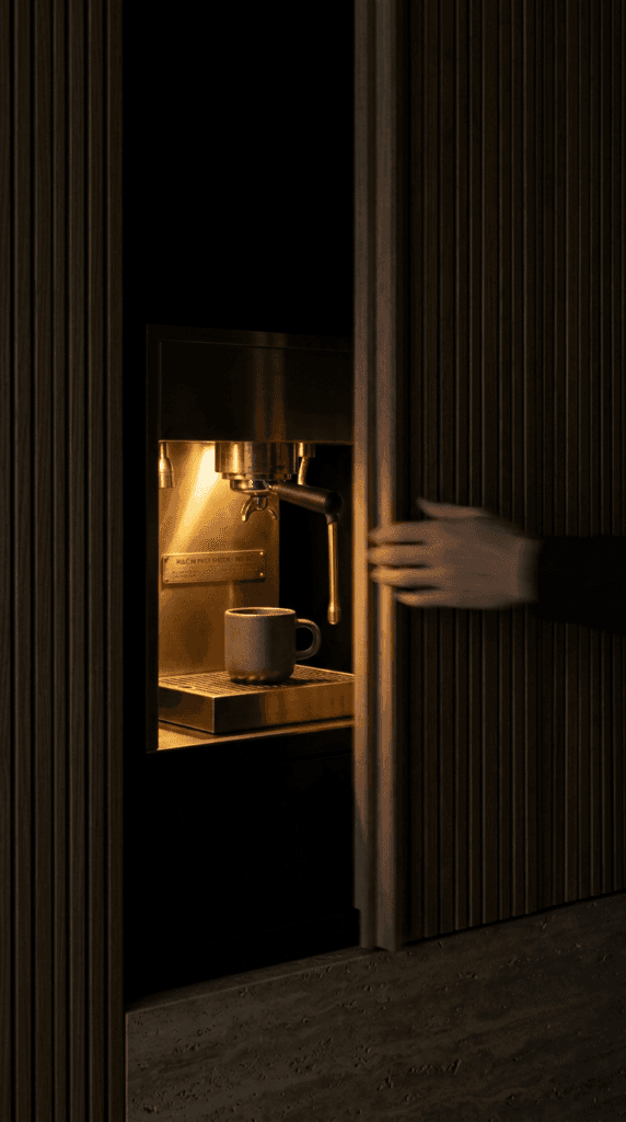 Close-up texture of seamless microcement counter and white ash cabinetry in minimalist kitchen design