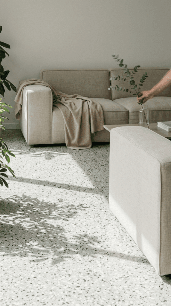 Brutalist-inspired raw concrete architectural wall paneling with deep, rhythmic shadow casting in a high-end minimalist residence.
